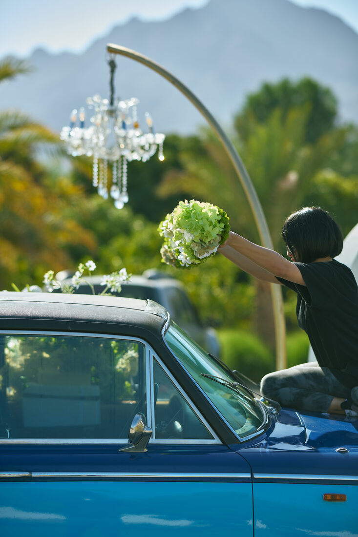 Flower Corner's classic wedding car dressed with fresh flowers